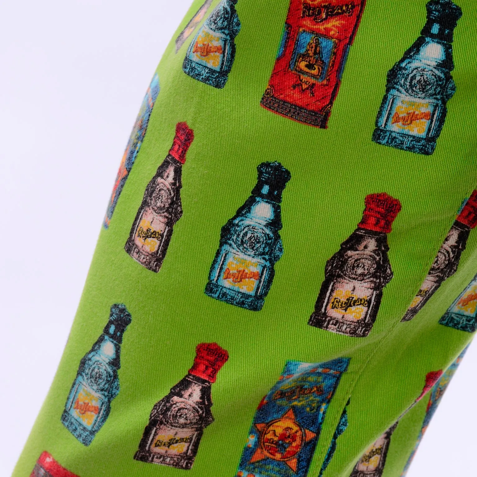 1990s Versace Jeans Couture Apple Green Bottle Print High Waist Pants