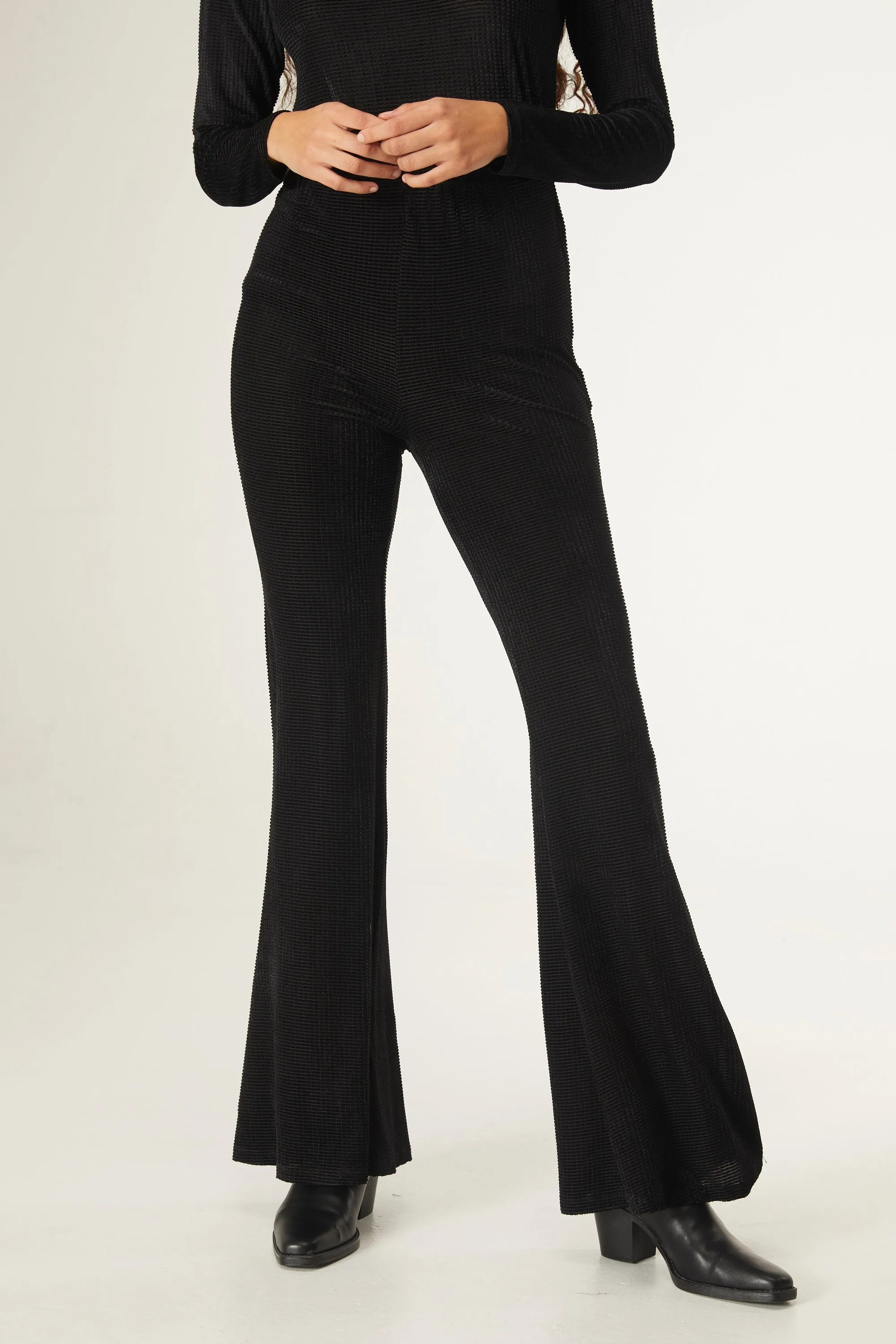 Black velvet flared trousers by Compania Fantastica