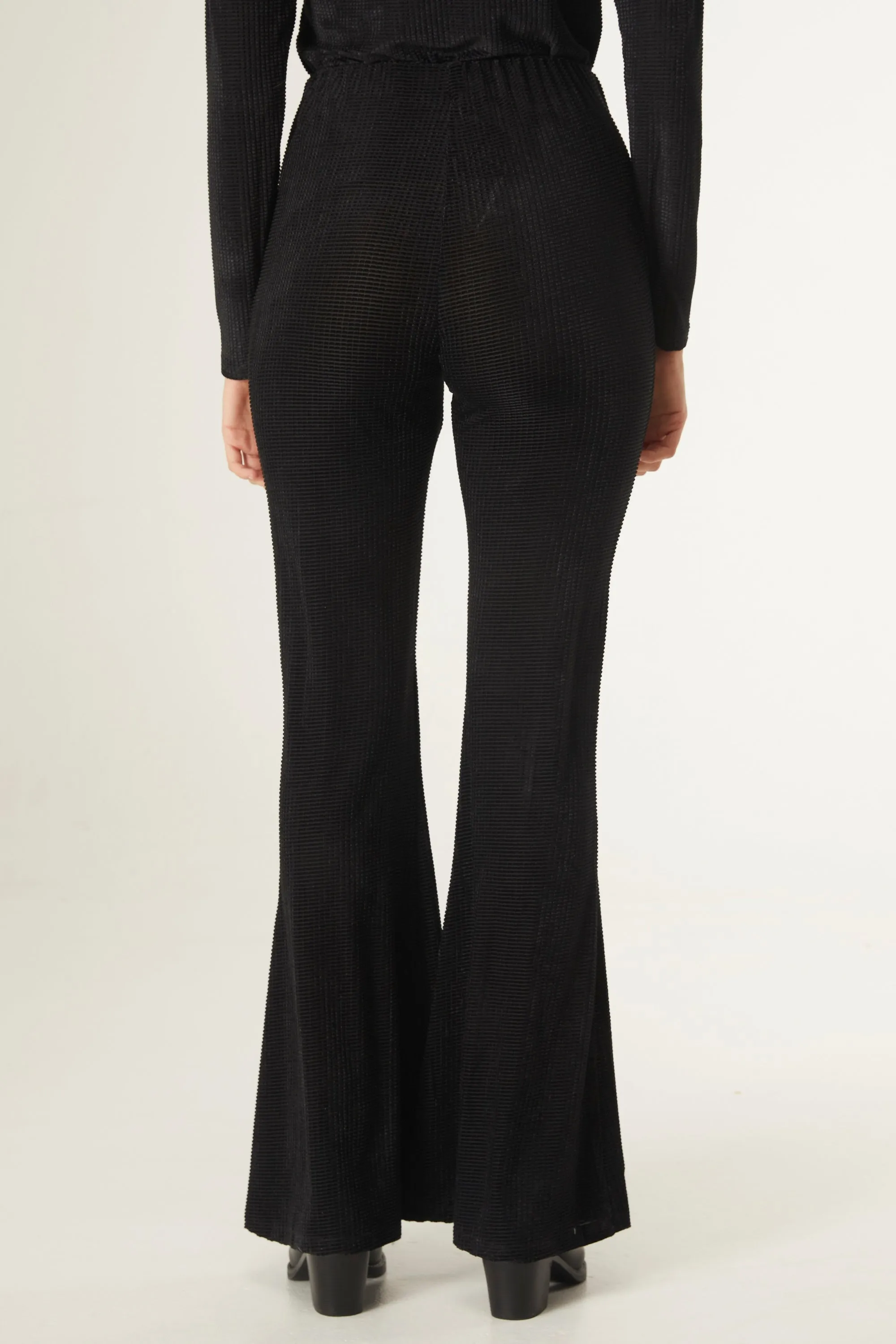 Black velvet flared trousers by Compania Fantastica