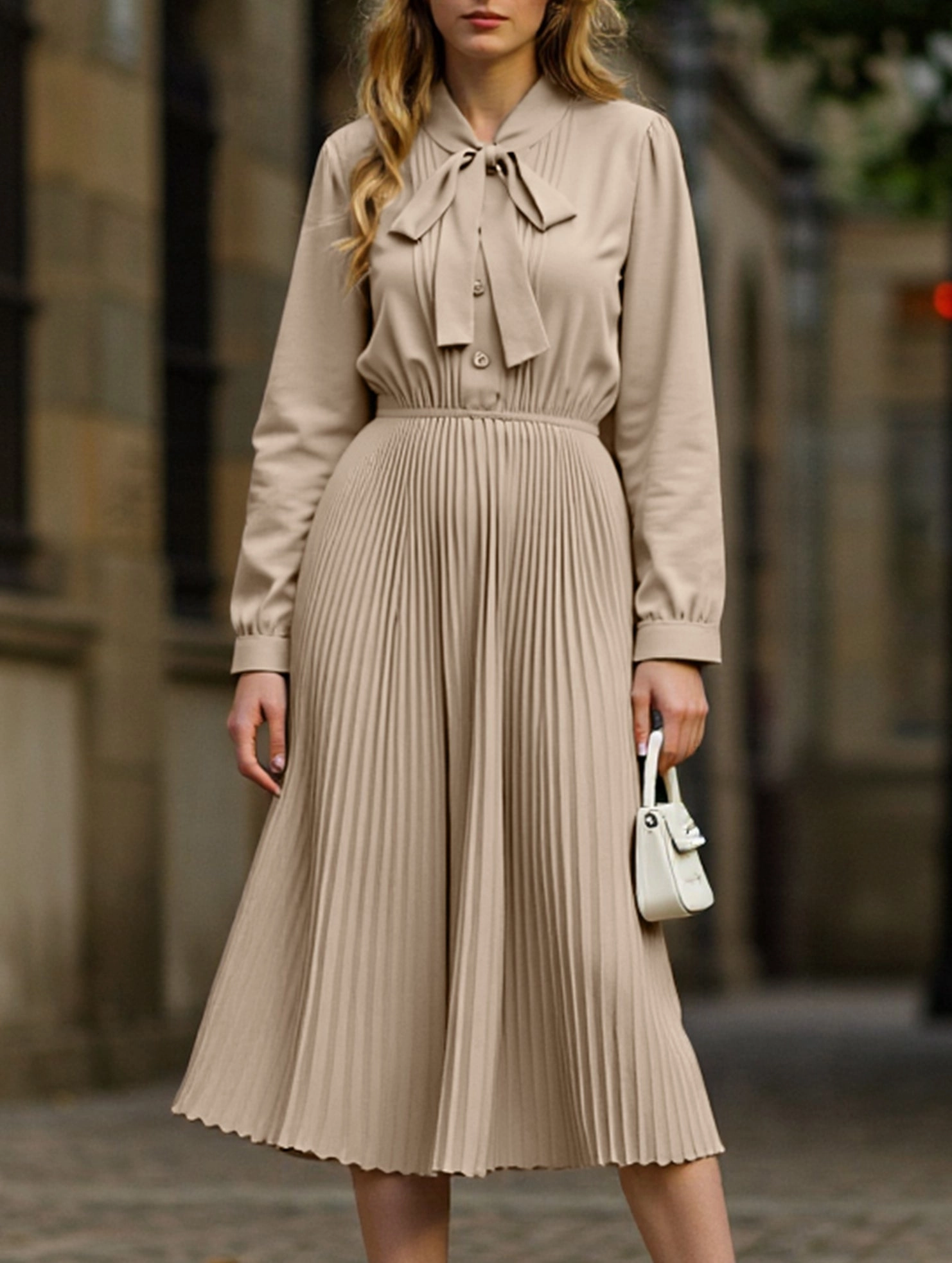 Elegant pleated dress with bow tie collar Eye Appeal