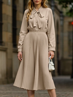 Elegant pleated dress with bow tie collar Eye Appeal