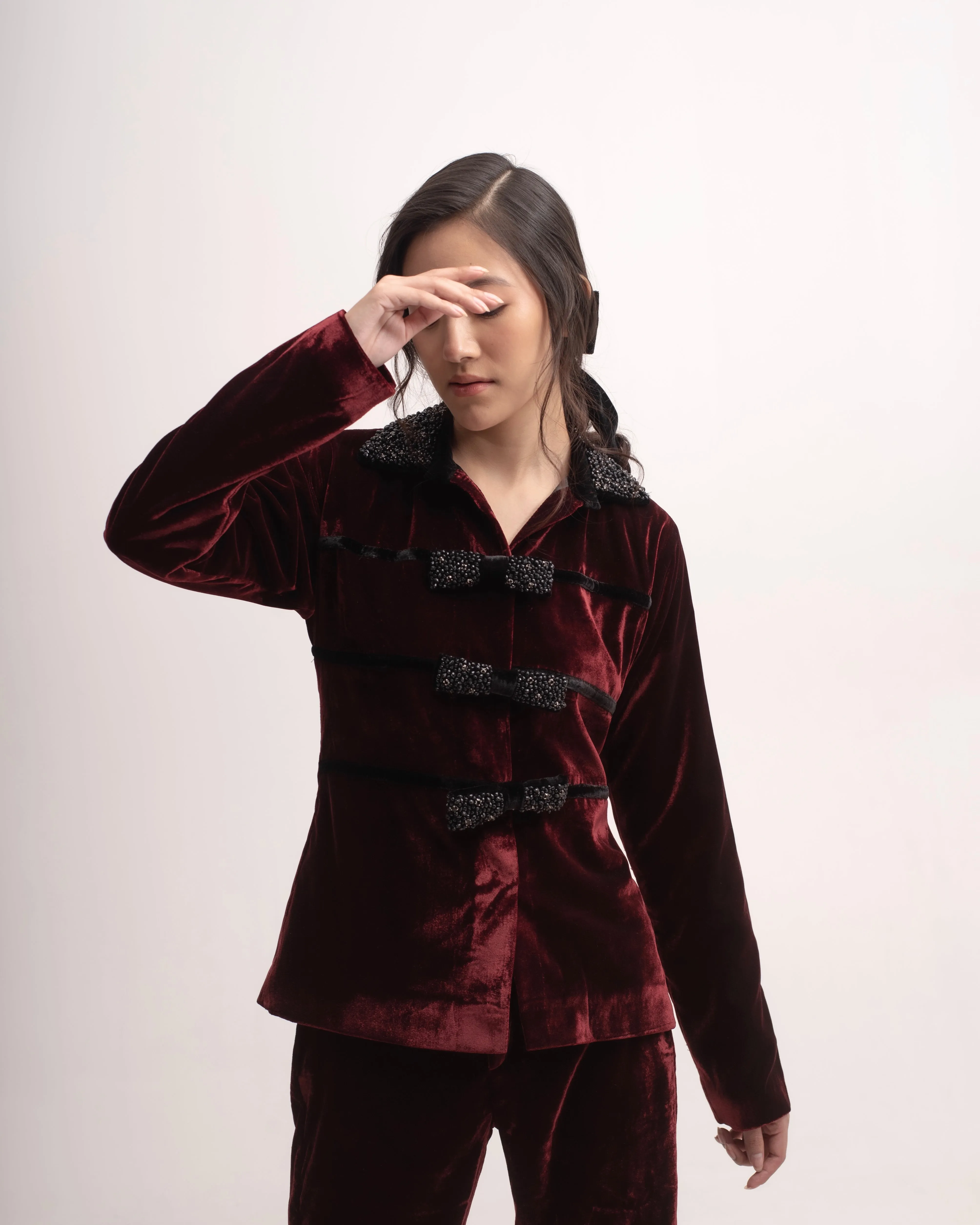 Silk-velvet high-waisted trousers with embellished bows