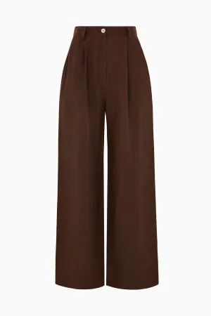 The Wabi Pleated Linen Trousers in chocolate