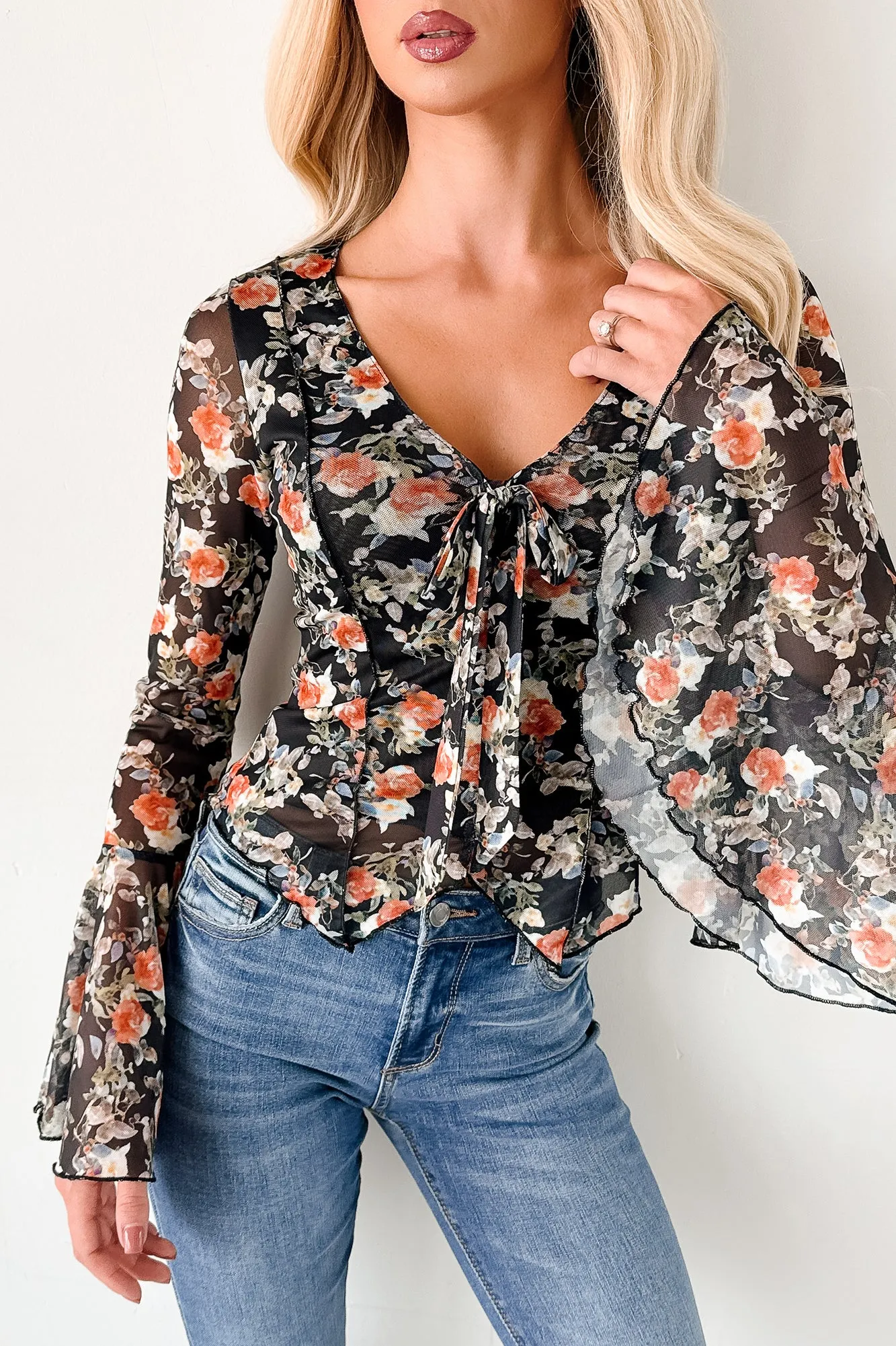 Weighted Hem Trim Holding Wildflowers Bell Sleeve Floral Top (Black)